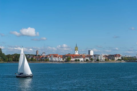 Cityscape, lakeside promenade, sailing boat, church tower, St. Nicholas Church, Friedrichshafen on