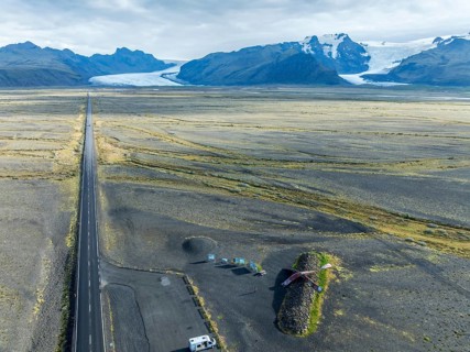 Aerial view of the Skeidara Bridge Monument viewpoint, large metal parts of the bridge that was