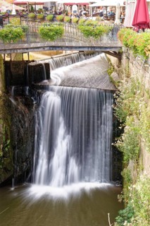 Waterfall of the Leuk and bridge over the Leukbach in the centre of Saarburg. Saarburg,