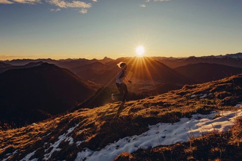 Trail running in autumn on the Jochberg on Lake Walchensee against the wonderful backdrop of the