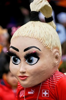 Person masked as footballer Alisha Lehmann at the carnival parade of the Wey guild on Rose Monday,
