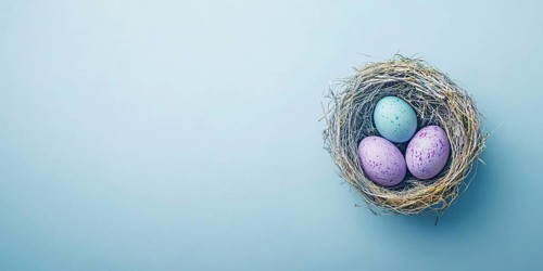 Small easter nest with purple painted eggs on blue background with copy space. Generative AI, AI