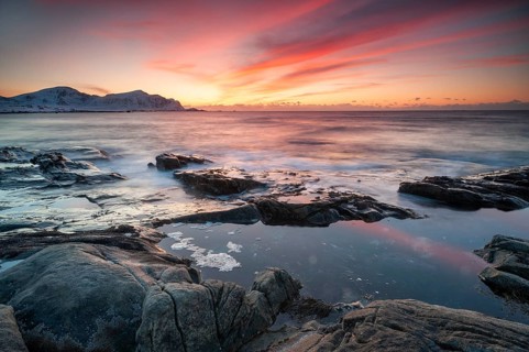 Sunset in winter at Skagsanden, rock formations on the beach at Flakstad, Flakstadøy, Lofoten,