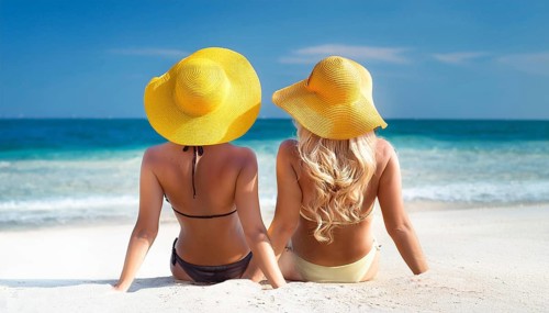 Two young woman on the beach in the Caribbean, Studio