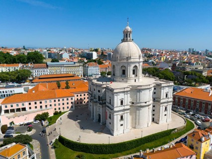 City view with a central large domed building surrounded by historical buildings and clear sky,
