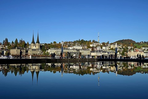 City view with St. Leodegar Court Church reflected in the fountain of the Culture and Convention
