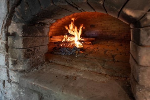 Wood fire in a baking oven in preparation for baking bread, baking oven festival in Franconia