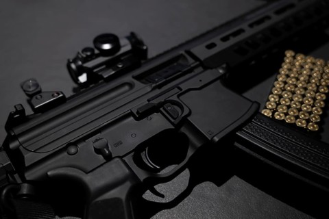 Modern Elegant Assault Rifle and Bullet on Grey Background in Switzerland
