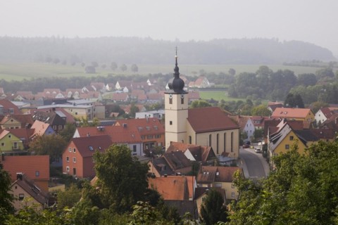 Medieval town of Feuchtwangen with clock tower and buildings with traditional terracotta ceramic