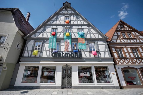 Historic half-timbered house with mattress advertising on the façade, Forchheim, Upper Franconia,