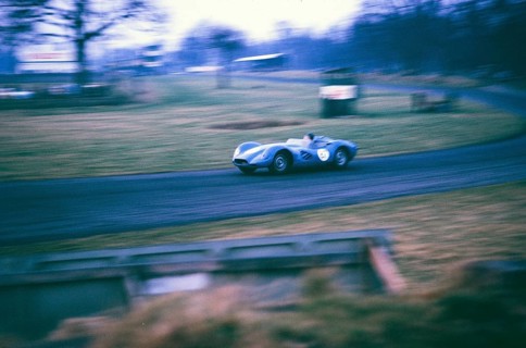 British sports racing driver Bill de Selincourt (1921 2014) at the wheel of a Lister Jaguar