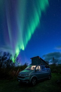 Northern lights over camper, VW California, Lyngen, Troms og Finnmark, Norway, Europe
