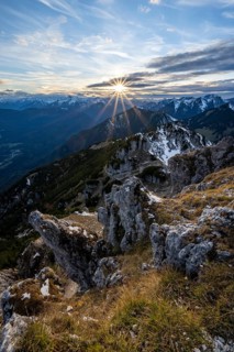 Mountain panorama, mountain landscape with sun star at sunset, at the summit of the Kramerspitz, in