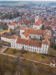 Central urban view with a prominent castle and a church between town buildings, Meßkirch, district