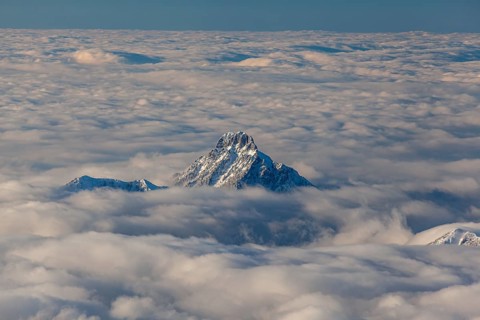 Mountain peak above high fog, evening light, winter, view from Zugspitze to Säuling, Bavarian Alps,