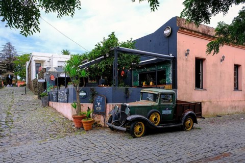 Colonia del Sacramento, Colonia, Uruguay, vintage cars parked in the alleyways of the old town.