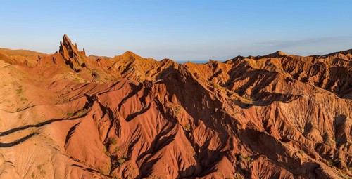 Aerial view, eroded mountain landscape, sandstone cliffs, canyon with red and orange rock