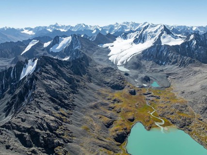 Mountain panorama, aerial view, 4000 metre peak with glacier, mountain pass and mountain lake
