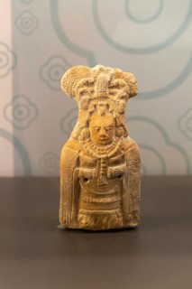 Ceramic figurine model of woman with mantle cloak, from Jaina, Late classical period, Mayan