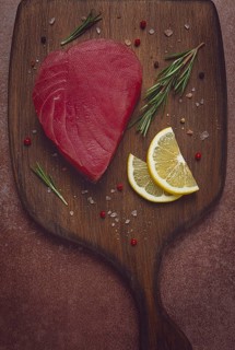 Fresh red tuna fillet, for steak, raw, top view, on a cutting board, no people