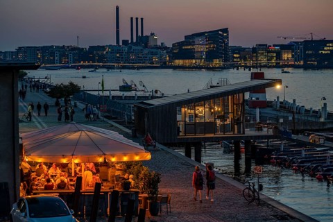 Summer evening in Copenhagen, at the harbour, Islands Brygge, people celebrating, eating, drinking,