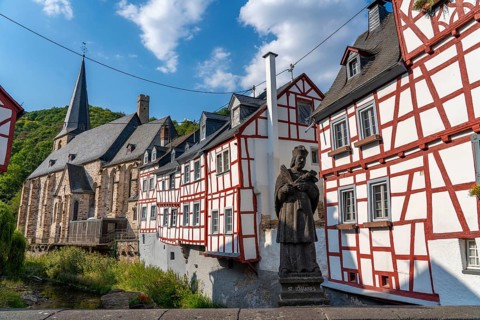 Monreal, idyllic half-timbered village in the Elz valley, figure of Nepomuk, the bridge saint, in