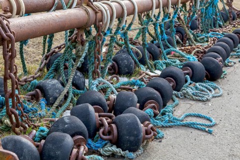 Spools and floats for bottom trawling with a trawl, drying on a road, Büsum, Schleswig-Holstein,