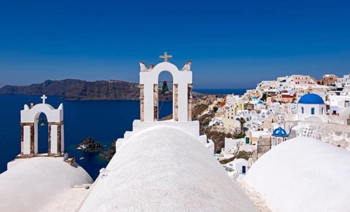 Bell towers in Oìa with a view of the caldera, Oía, Santorini, Cyclades, Greece, Europe