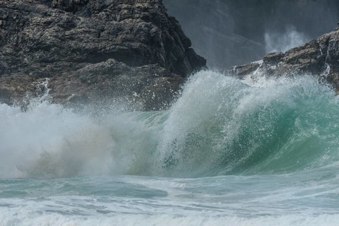 Large waves of the Atlantic Ocean crash against the rocks of a cliff. Camaret sur mer, Crozon,