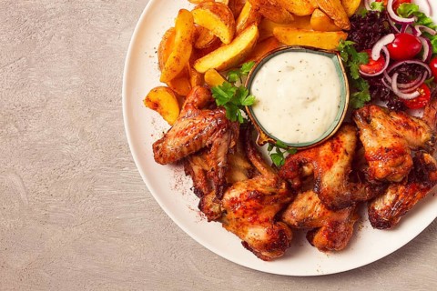 Fried chicken wings, with potatoes, and spices, homemade, fast food, no people