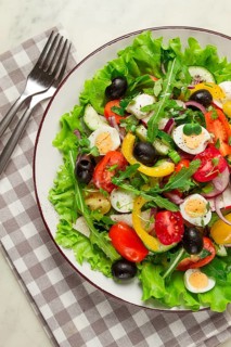 Vegetable salad, with quail eggs and olives, fresh, close-up, no people