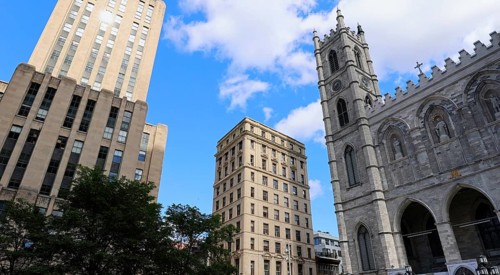 Place d'Armes square and Notre-Dame Basilica in Old Montreal historic town near Old Port
