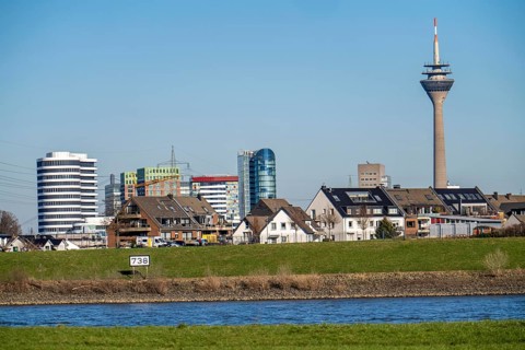 The skyline of Düsseldorf, with the skyscrapers in the Media Harbour, Rhine Tower, in front