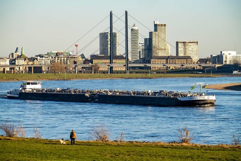 Düsseldorf, city centre skyline, skyscrapers, Rheinkniebrücke, Rhine, cargo ship