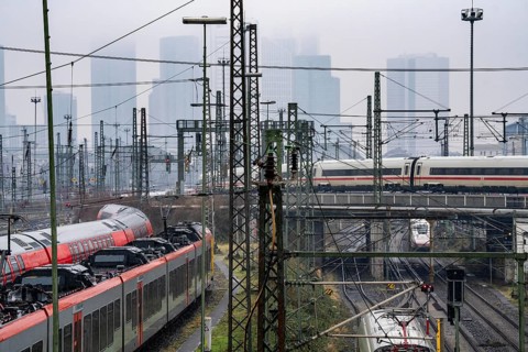 Railway tracks with regional and long-distance trains, ICE, after freezing rain, in front of