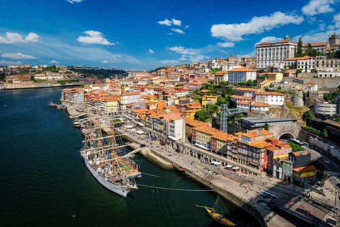Aerial view of Porto city and Douro river with moored sailling ship from Dom Luis bridge I. Porto,