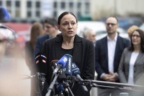 Dr Daniela Büchel, Head of Human Resources at REWE Group, answers questions from the press after a