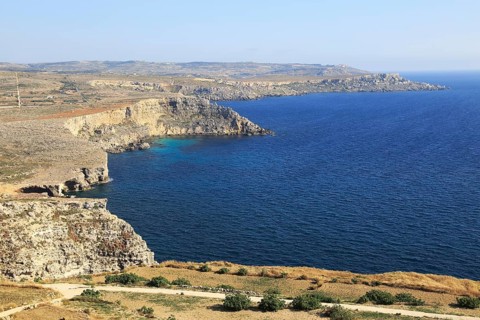 Coastal scenery of cliffs and blue sea looking south from Res il-Qammieh, Marfa Peninsula, Republic