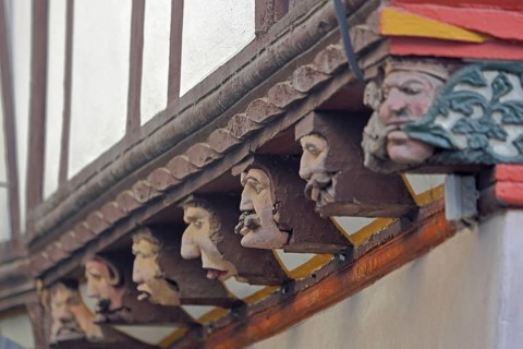Seven envious heads on the historic House of the Seven Vices built in 1567, symbol, allegory, wood