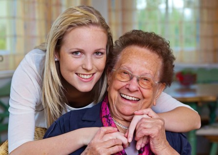 A grandson visits his grandmother Fun and joy while hugging, Vienna, Austria, Europe