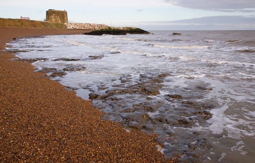London Clay wave cut platform exposed at low tide on the beach at East Lane, Bawdsey, Suffolk,