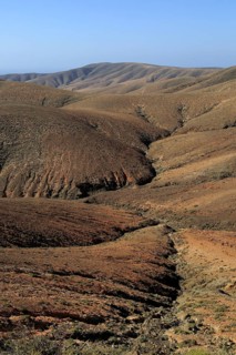 Bare moon-like arid landscape in mountains between Pajara and La Pared, Fuerteventura, Canary