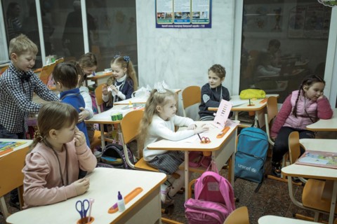 Pupils in a classroom in one of the metro schools in Kharkiv. Classrooms were set up in various