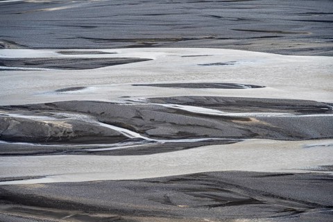 Detail, structure, river course in a gravel bed with black sand, meandering river, Dímonarhellir,