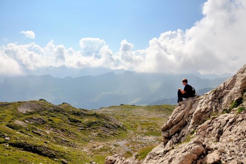 Ten-year-old boy hiking, short rest, Nebelhorn, Allgäu Alps, Bavaria, Germany, Europe