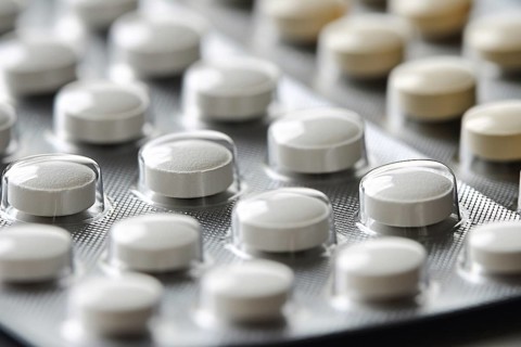 Close up of white medical pills in blister pack. Generative Ai, AI generated