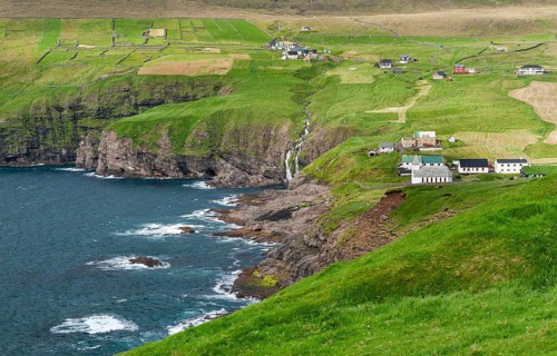 Fields and village on rocky coast, Vidareidi, Vidoy Island, Viðareiði, Viðoy Island, Faroe Islands,