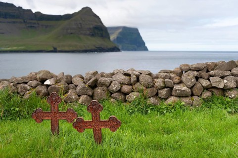 Old iron crosses, stone wall, cemetery, Vidareidi, Vidoy Island, Viðareiði, Viðoy Island, Faroe