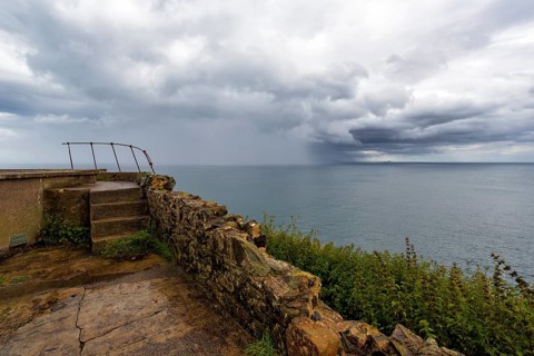 Rain clouds over the sea, coastline between Ballycastle and Ballintoy, viewpoint, Causeway Coastal