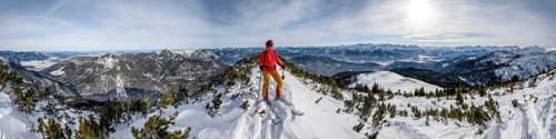 Ski tourer at the summit of Simetsberg, panorama with Walchensee, mountain panorama, Estergebirge,